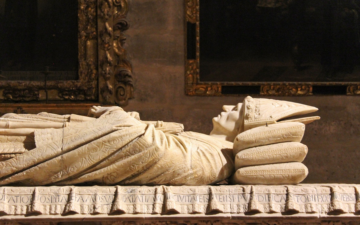 Tomb sculpture inside Seville Cathedral, Spain.