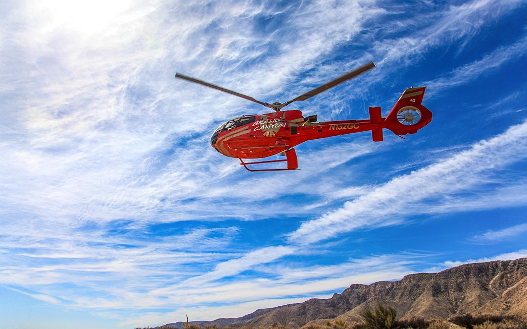 Helicopter flying over Horseshoe Bend during a scenic tour, highlighting the natural landscape.