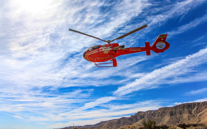 Helicopter flying over Horseshoe Bend during a scenic tour, highlighting the natural landscape.