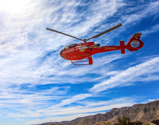 Helicopter flying over Horseshoe Bend during a scenic tour, highlighting the natural landscape.