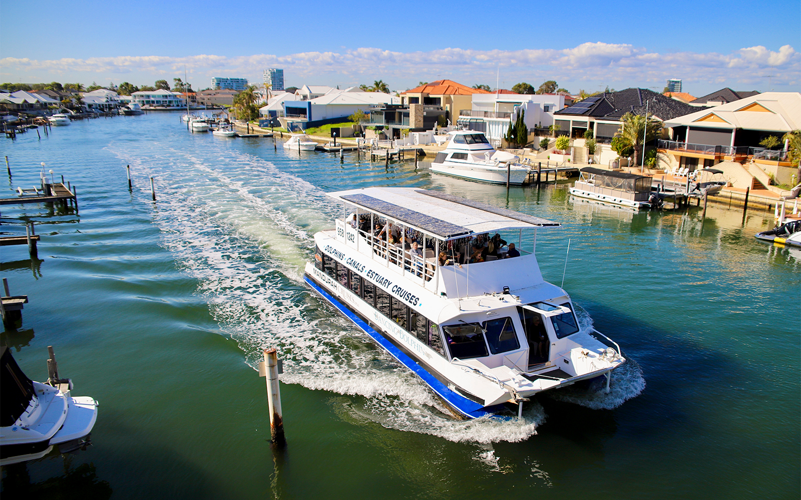Tourists on a canal cruise boat in Mandurah, Australia.