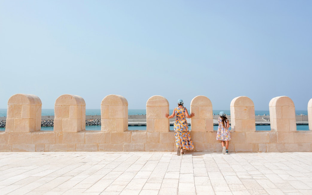 Mother and daughter view the sea from Qaitbay Citadel, Alexandria.