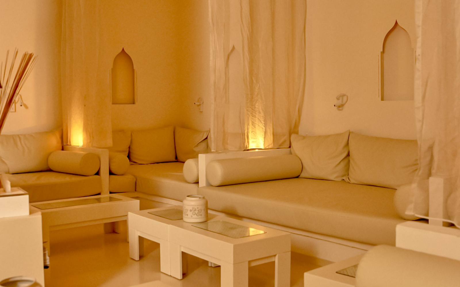 Cozy relaxation area at Mandala Day Spa with soft lighting and comfortable seating.