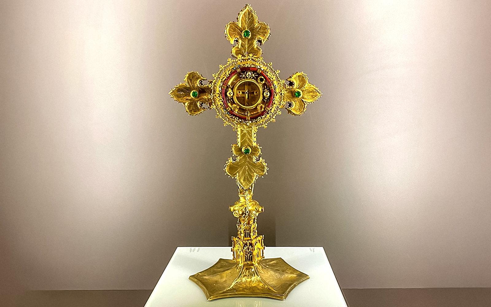 Golden cross with intricate design at St. George's Castle Church.