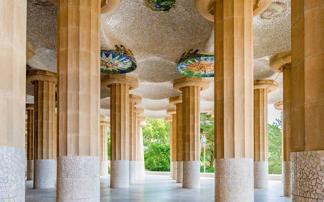 Columns and mosaic ceiling of Hypostyle Hall in Park Guell, Barcelona.