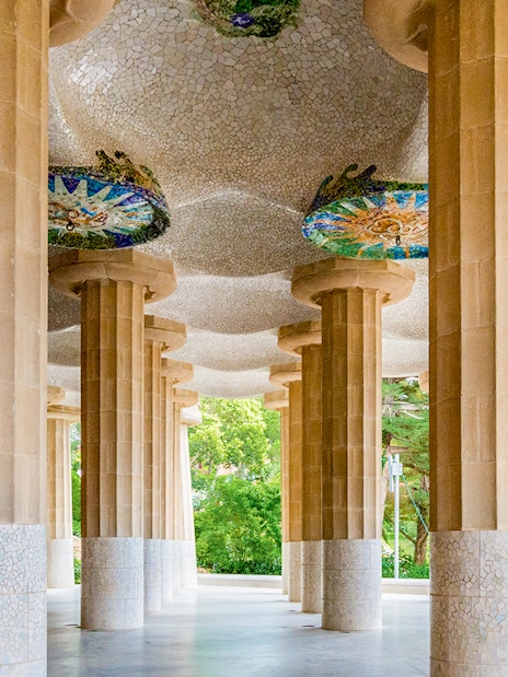 Columns and mosaic ceiling of Hypostyle Hall in Park Guell, Barcelona.