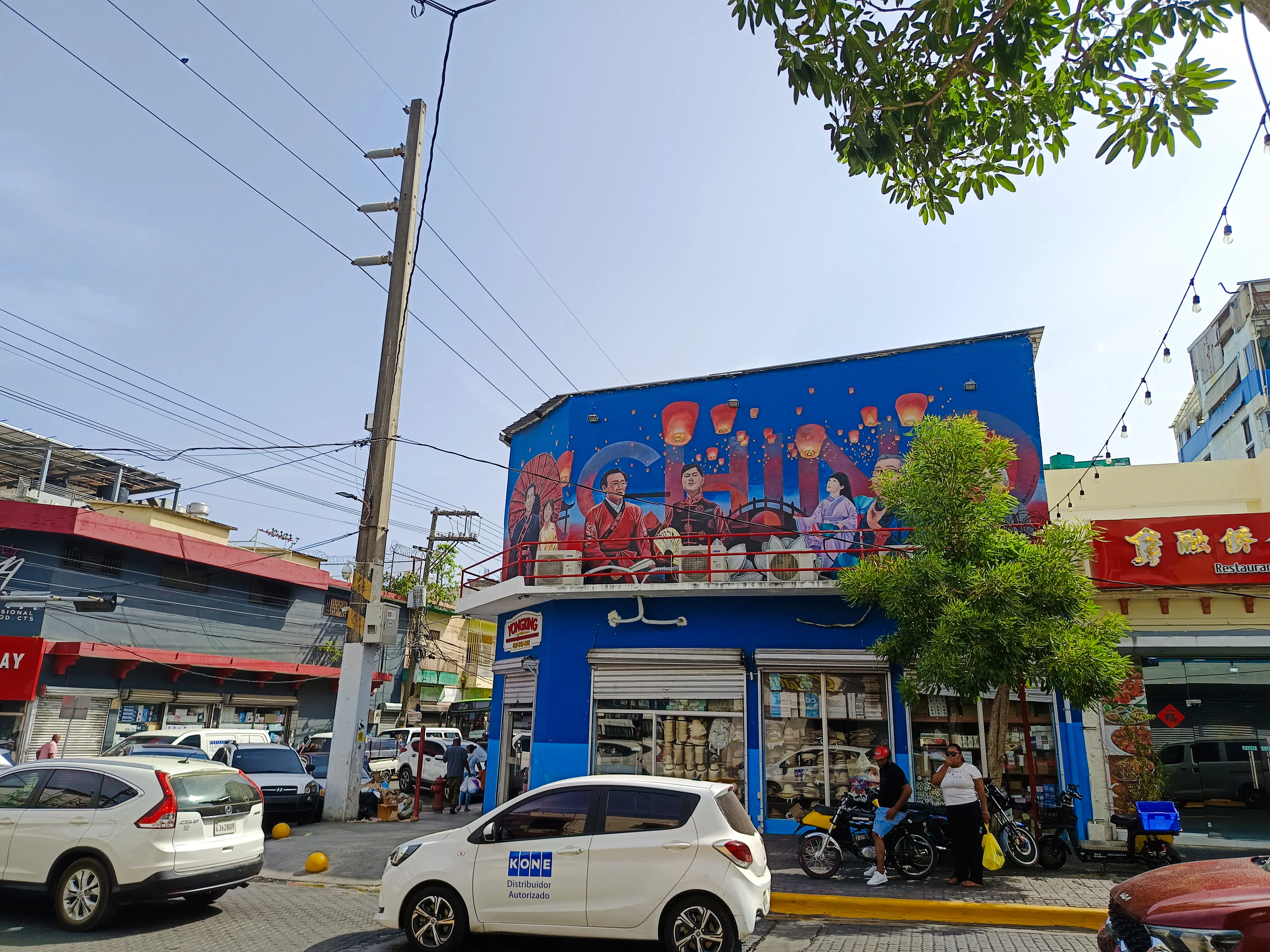 Chinatown mural in Santo Domingo with lanterns and cultural figures, part of a food walking tour.
