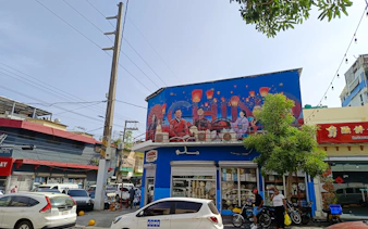 Chinatown mural in Santo Domingo with lanterns and cultural figures, part of a food walking tour.