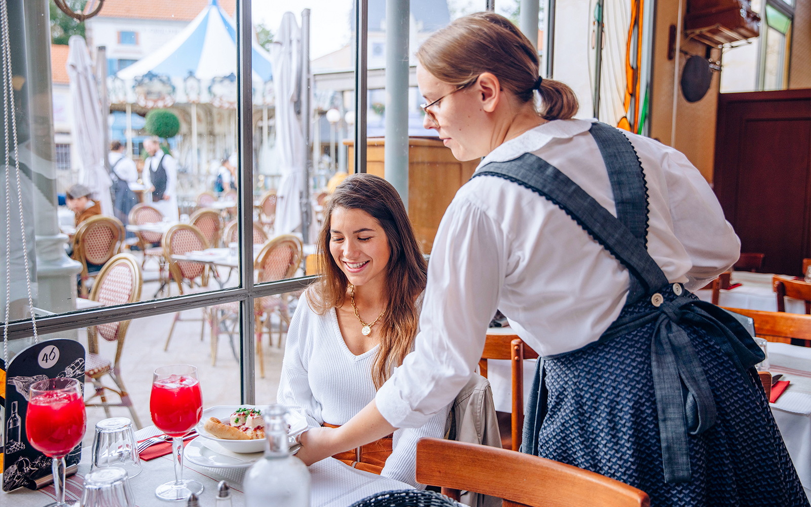 Dining experience at Puy du Fou, France with traditional French cuisine.