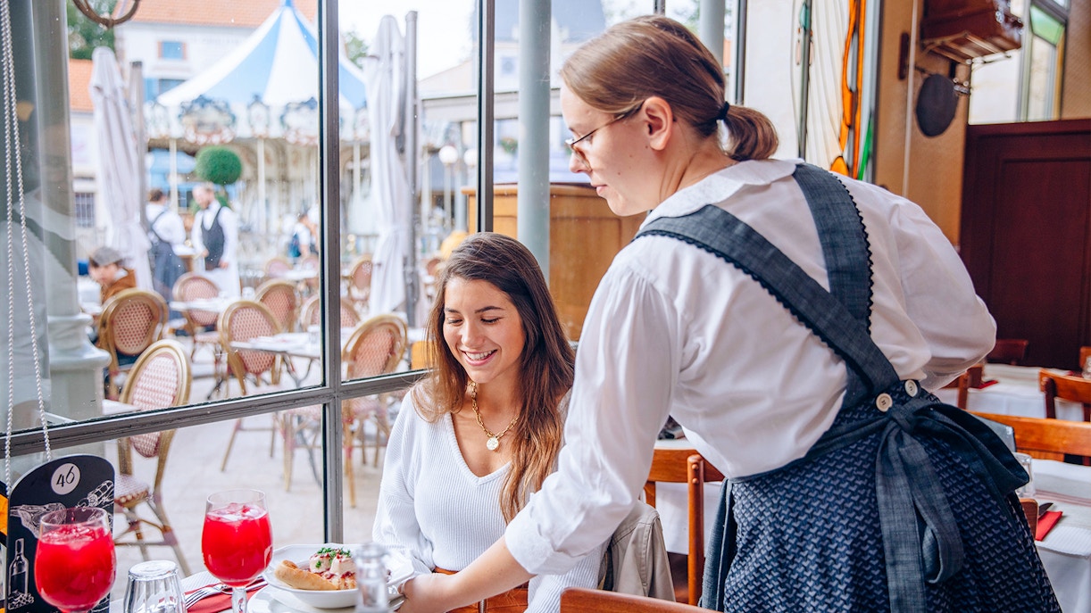 Dining experience at Puy du Fou, France with traditional French cuisine.