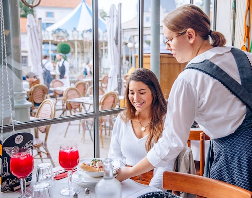 Dining experience at Puy du Fou, France with traditional French cuisine.