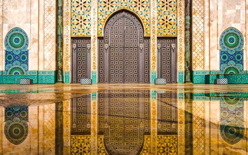 Fountain reflecting intricate mosaic tiles at Hassan II Mosque, Casablanca, Morocco.