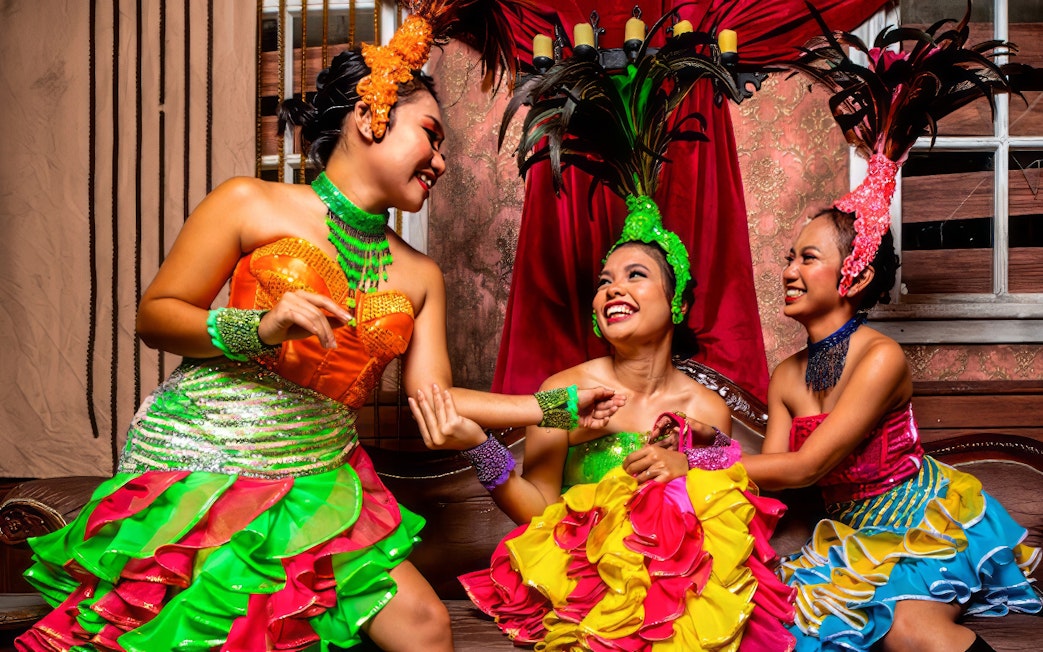 Performers in colorful costumes at Sunway Lagoon Night Park.