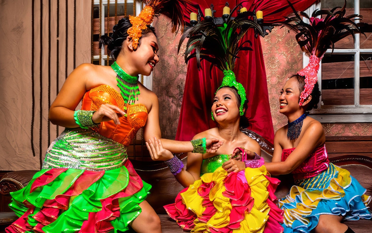 Performers in colorful costumes at Sunway Lagoon Night Park.