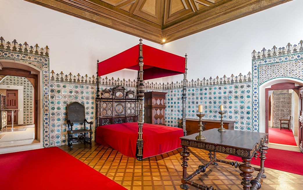 Golden Chamber with ornate bed and tiled walls, National Palace of Sintra, Portugal.