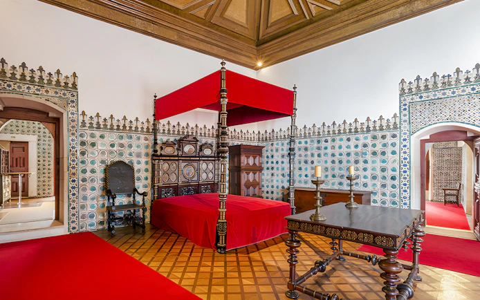 Golden Chamber with ornate bed and tiled walls, National Palace of Sintra, Portugal.