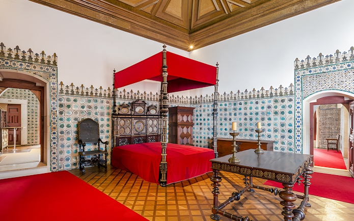 Golden Chamber with ornate bed and tiled walls, National Palace of Sintra, Portugal.