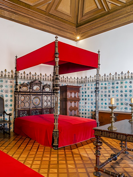 Golden Chamber with ornate bed and tiled walls, National Palace of Sintra, Portugal.