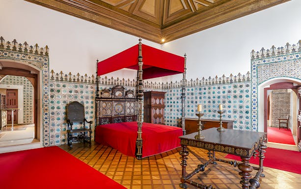 Golden Chamber with ornate bed and tiled walls, National Palace of Sintra, Portugal.