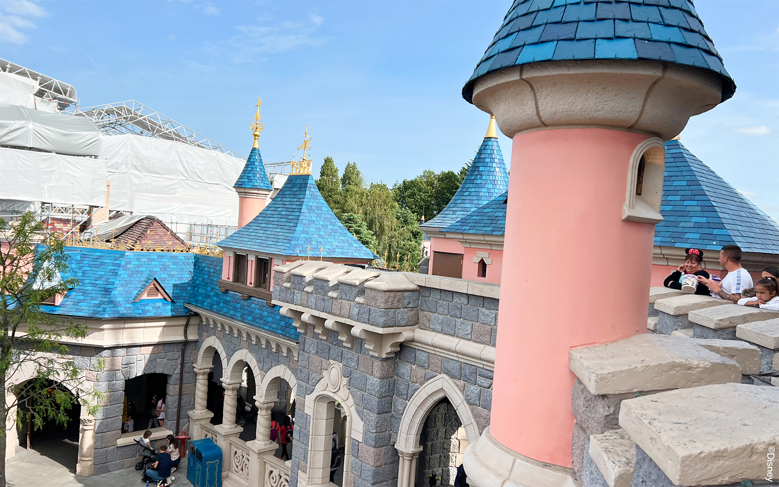 Sleeping Beauty's Castle balcony view at Disneyland Paris with intricate architectural details.