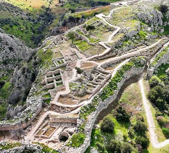 Aerial view of the ancient citadel of Mycenae with ruins and pathways, Argolida, Greece.