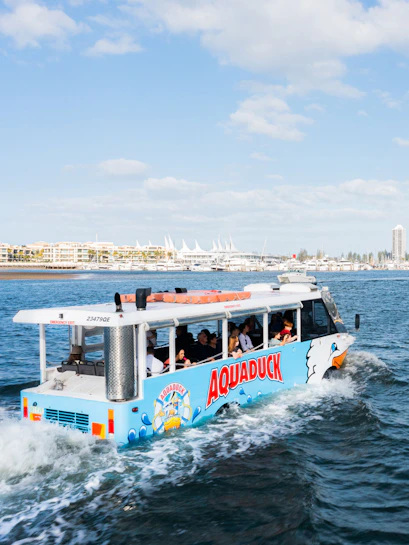 Aquaduck tour boat cruising on Sunshine Coast water with passengers onboard.