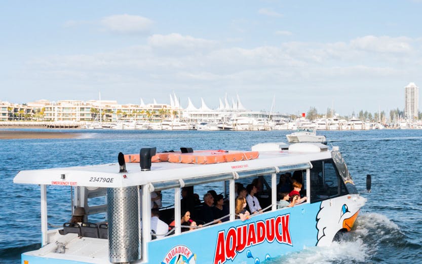 Aquaduck tour boat cruising on Sunshine Coast water with passengers onboard.
