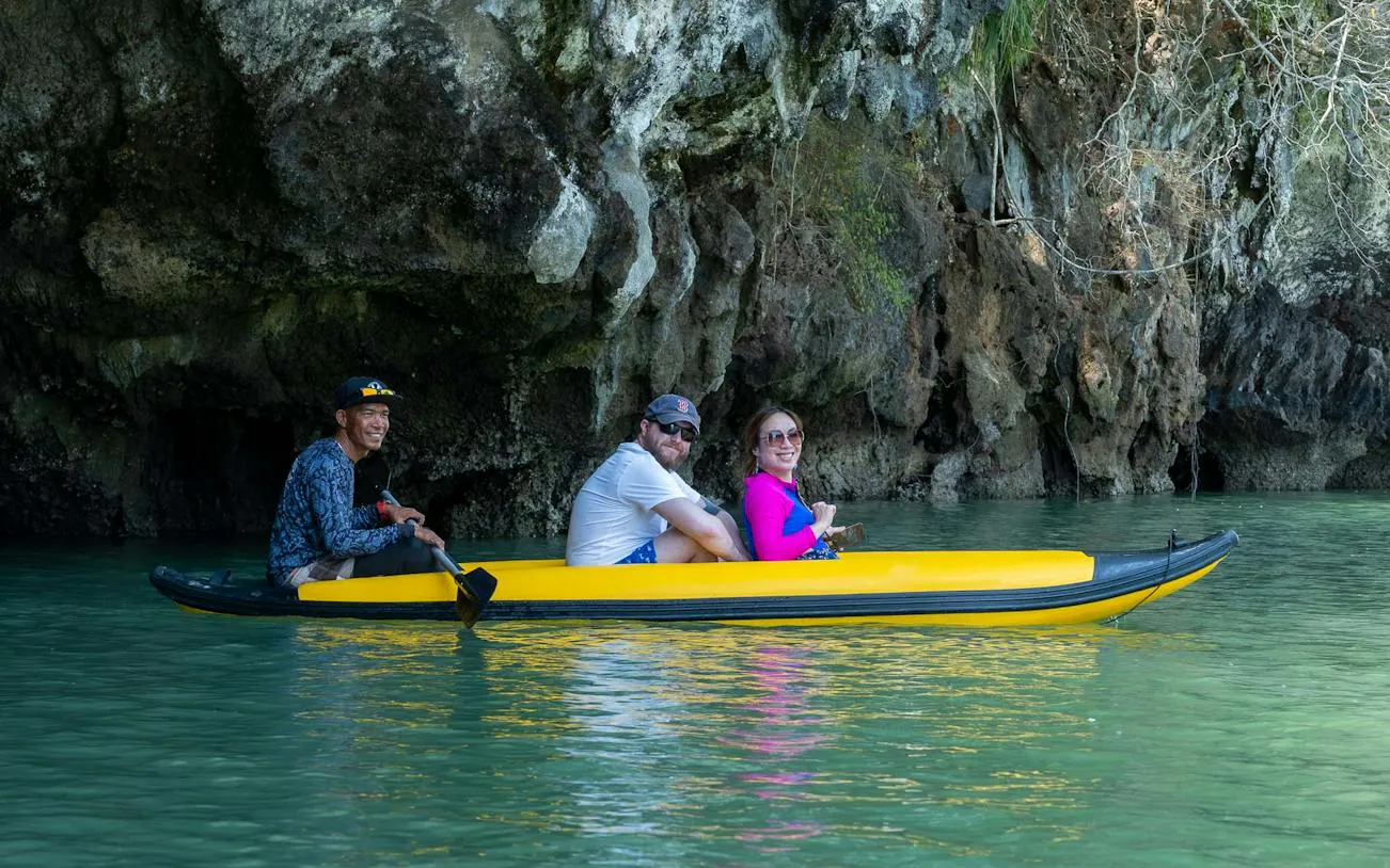 Kayaking near limestone cliffs on James Bond Island, Phang Nga Bay tour from Phuket.