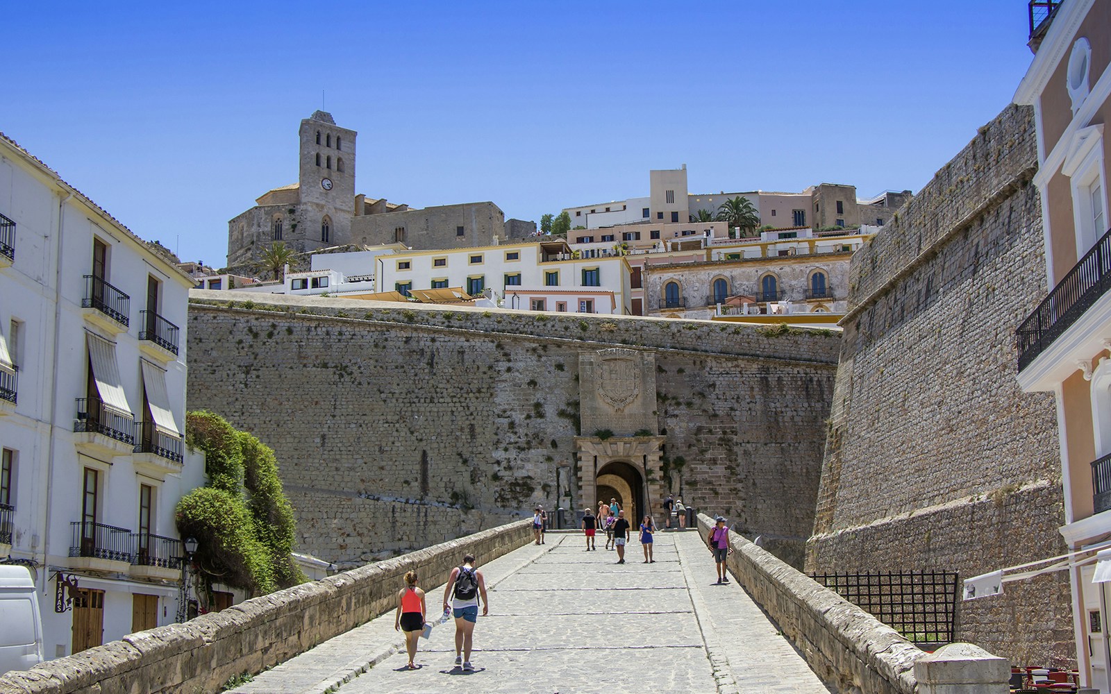 People taking entry into the old town Ibiza, called as Dalt Vila