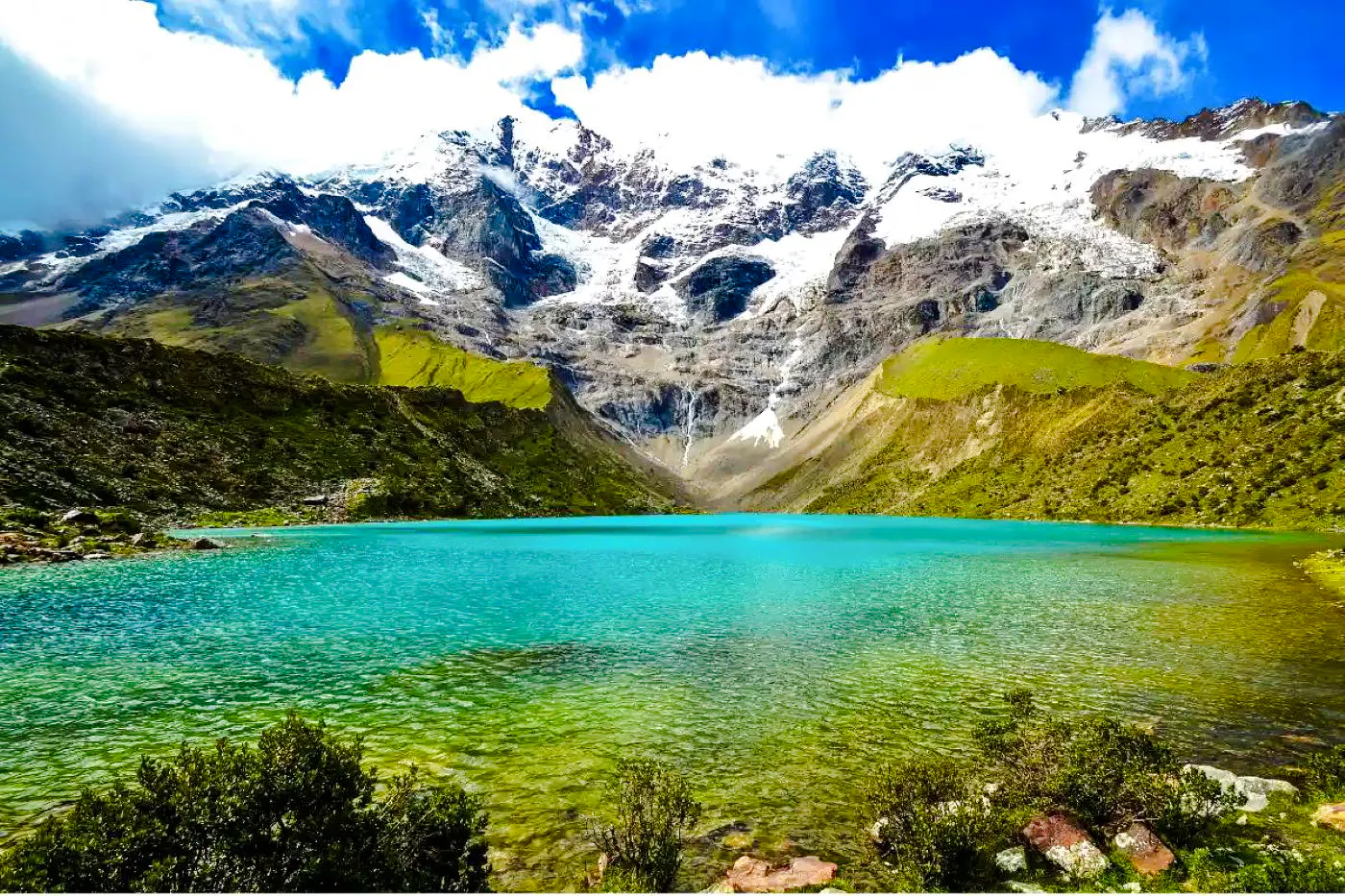 Humantay Lake with turquoise water and snow-capped mountains, Cusco day hike.