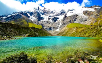 Humantay Lake with turquoise water and snow-capped mountains, Cusco day hike.