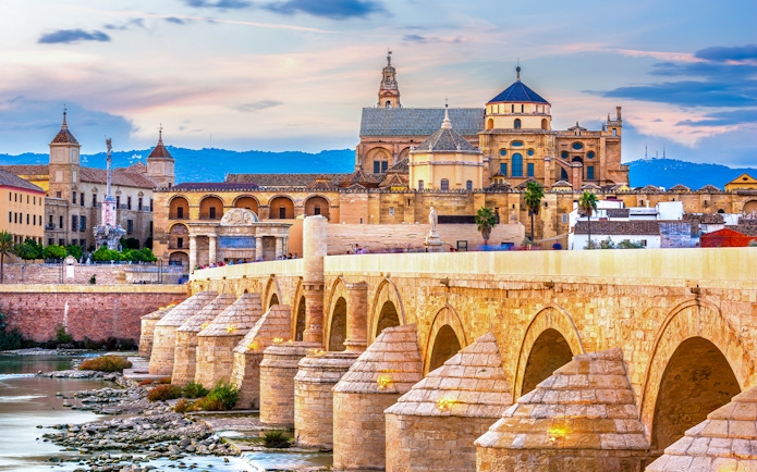 Roman Bridge and Mosque-Cathedral in Cordoba, Spain skyline.