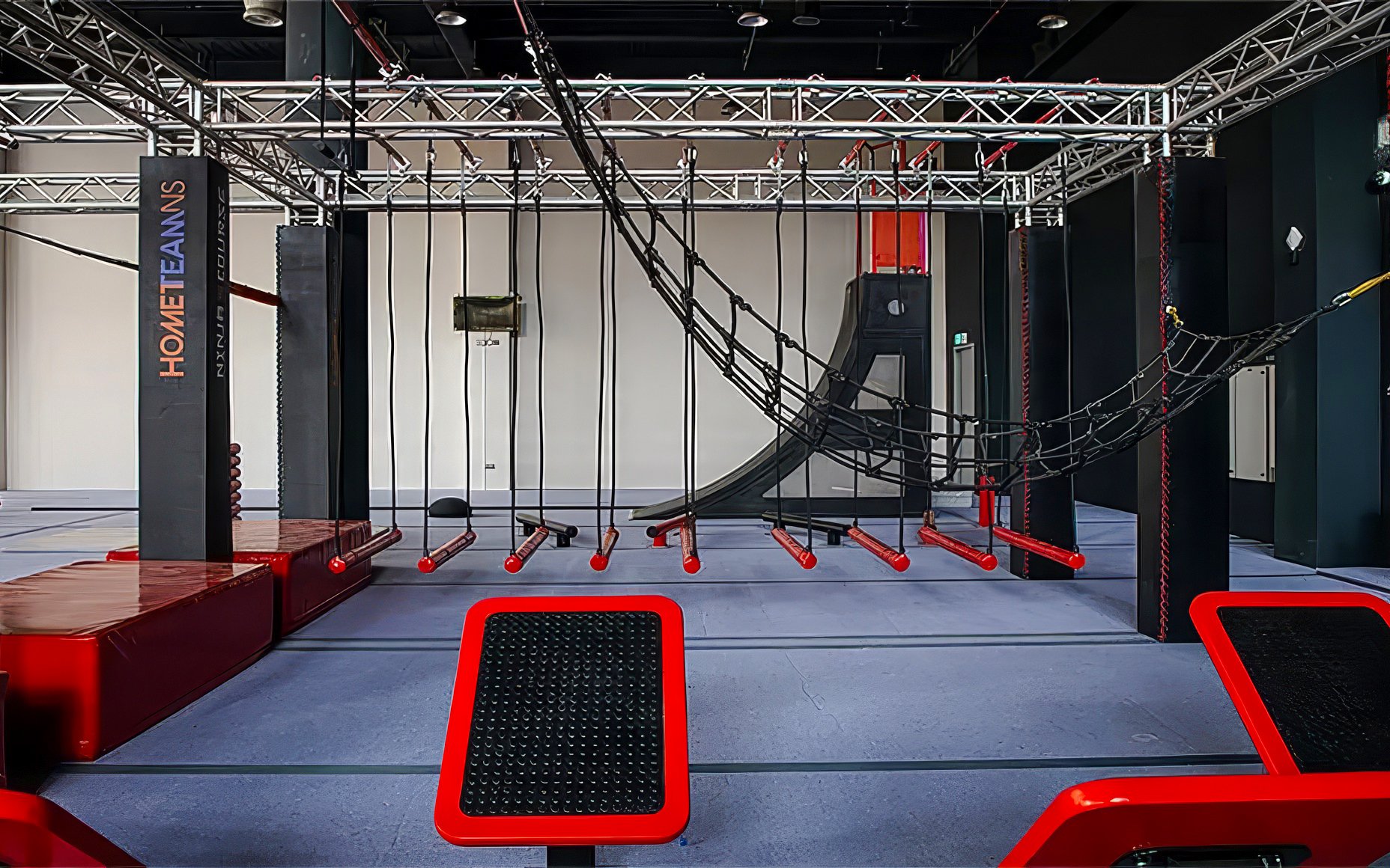 Indoor obstacle course at T-Play Khatib featuring ropes and climbing structures.