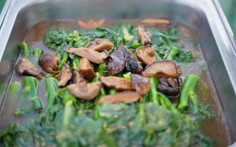Stir-fried greens with mushrooms served on Riverside Carnival Cruise in Bangkok.