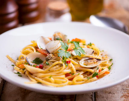 Pasta with clams and herbs, part of Bruny Island lighthouse tour food tasting, Hobart departure.