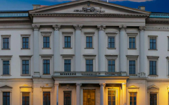 Historic building facade in Stockholm, part of the Secret Societies city exploration game.