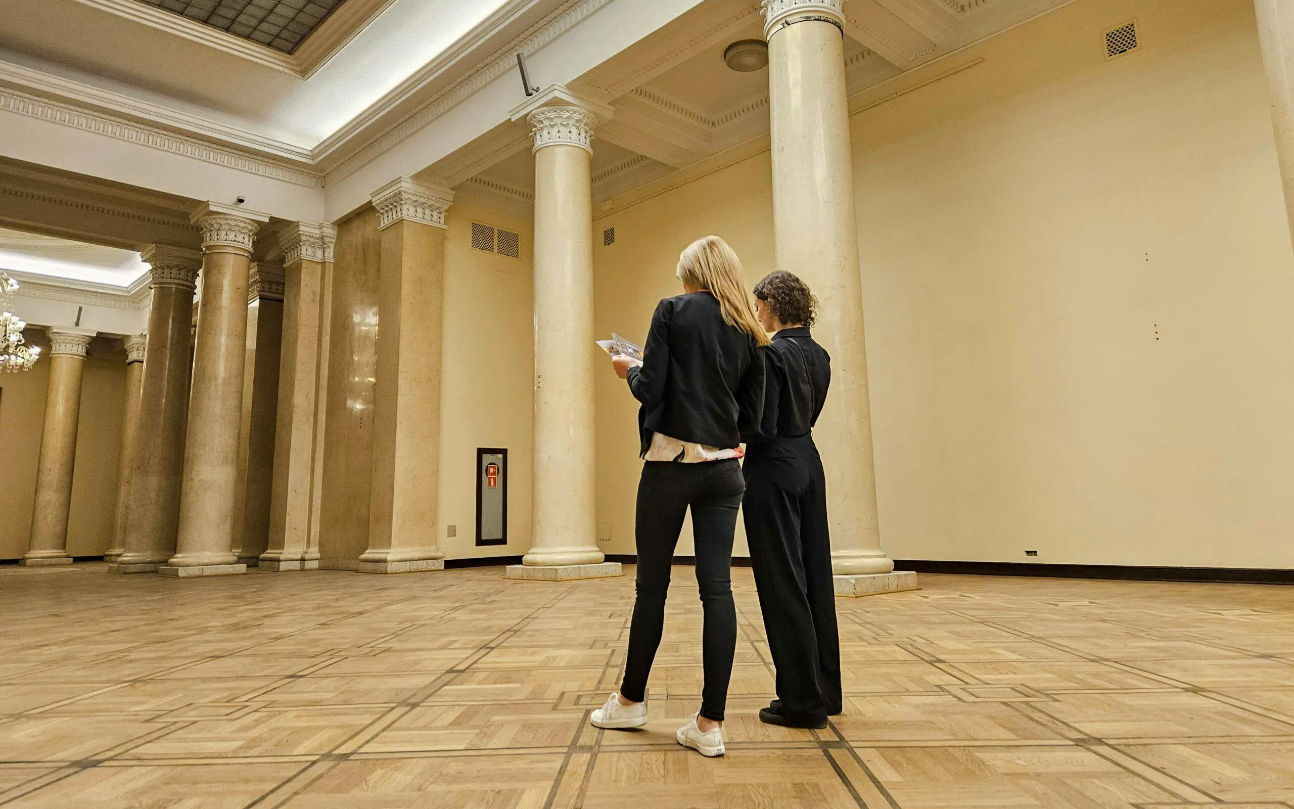 Visitors exploring the interior of the Palace of Culture and Science, Warsaw.