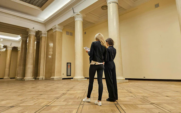 Visitors exploring the interior of the Palace of Culture and Science, Warsaw.