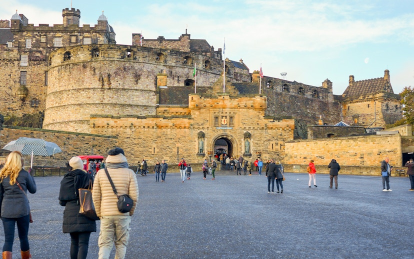 Visitors walking towards the Esplanade Entrance of Edinburgh Castle, Scotland.