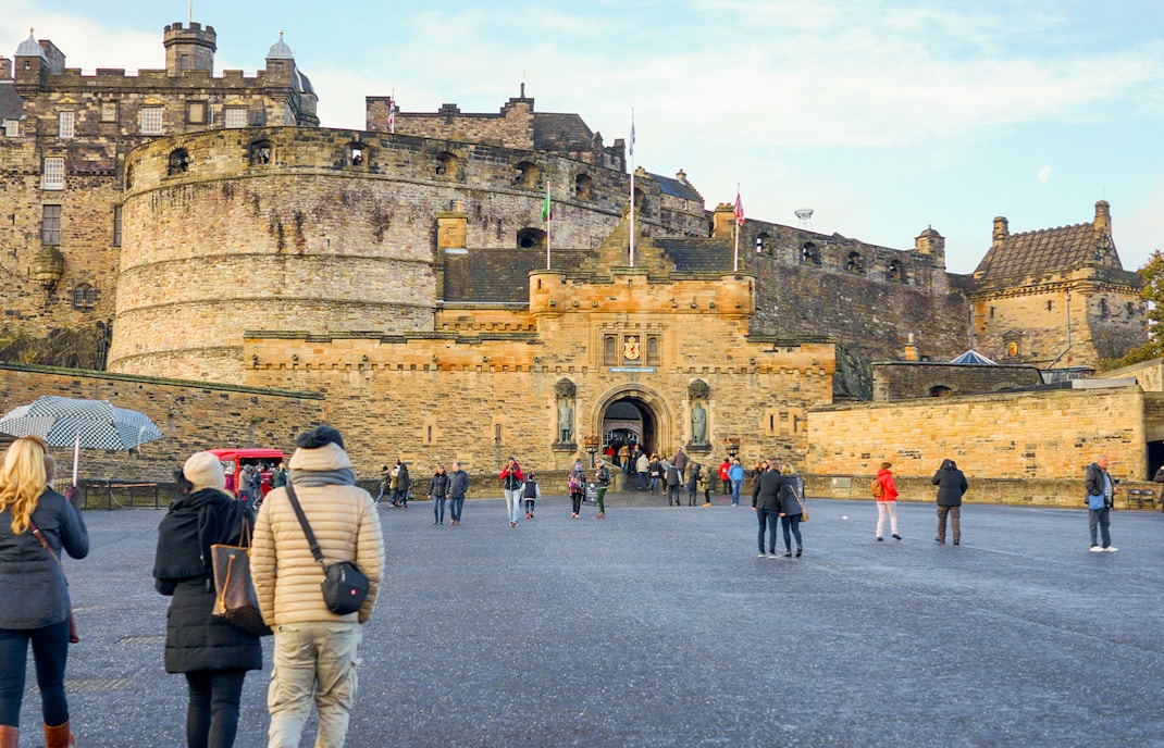 Visitors walking towards the Esplanade Entrance of Edinburgh Castle, Scotland.
