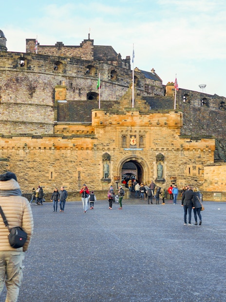Visitors walking towards the Esplanade Entrance of Edinburgh Castle, Scotland.