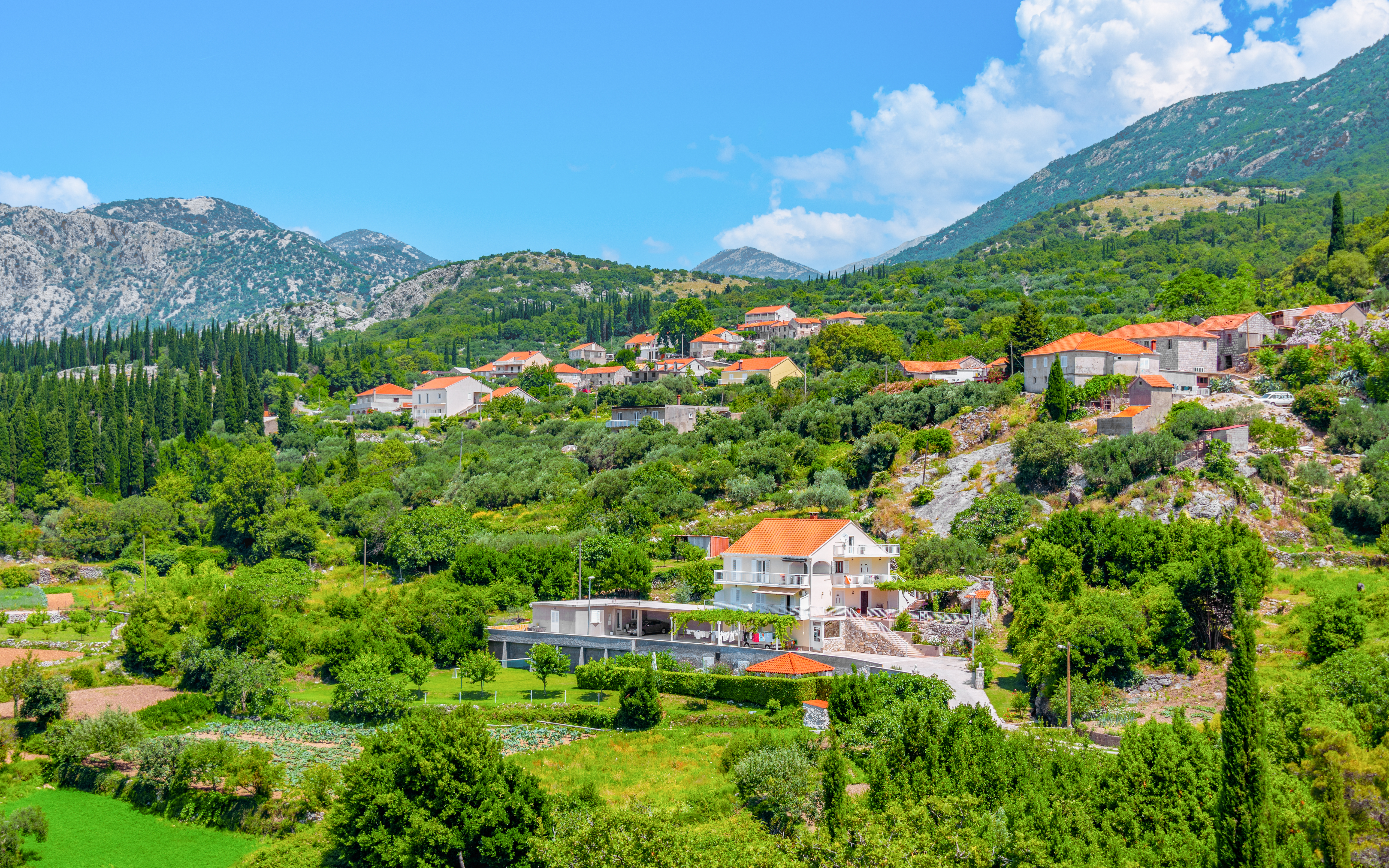 Hillside village with red-roofed houses in the Croatian countryside near Sokol fortress, Konavle.