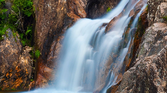 Waterfall cascading over rocks in Peneda Gerês National Park, Portugal.