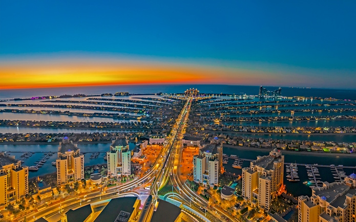 Aerial view of Palm Jumeirah at sunset, Dubai, seen from The View At The Palm.