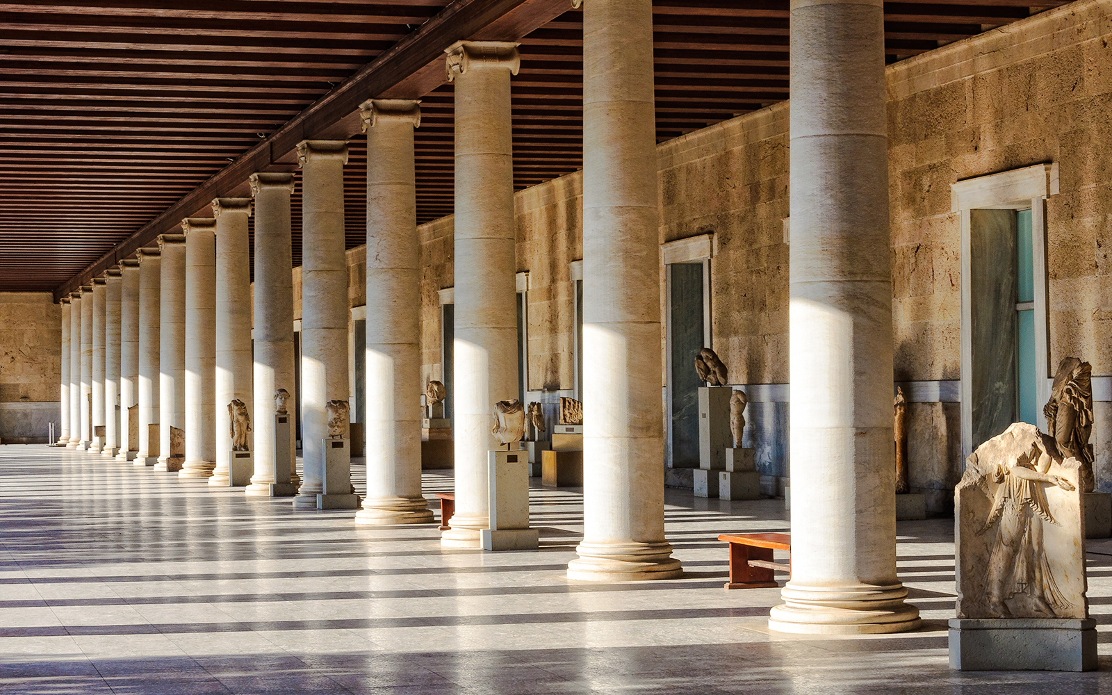 Columns and statues inside the Stoa of Attalos, Athens, Greece.