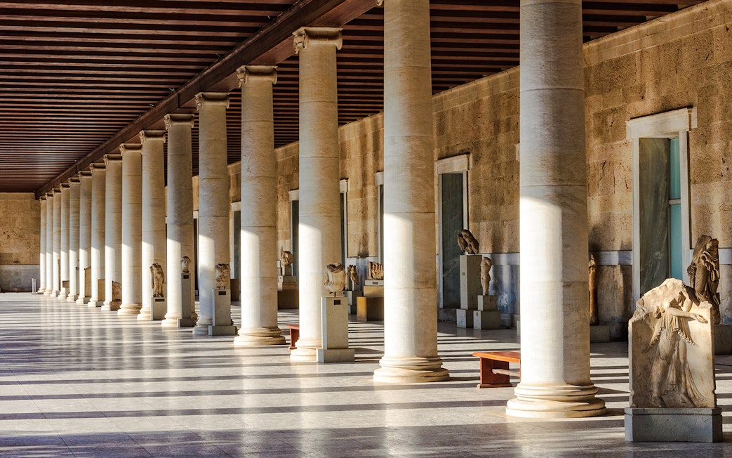 Columns and statues inside the Stoa of Attalos, Athens, Greece.