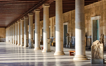 Columns and statues inside the Stoa of Attalos, Athens, Greece.