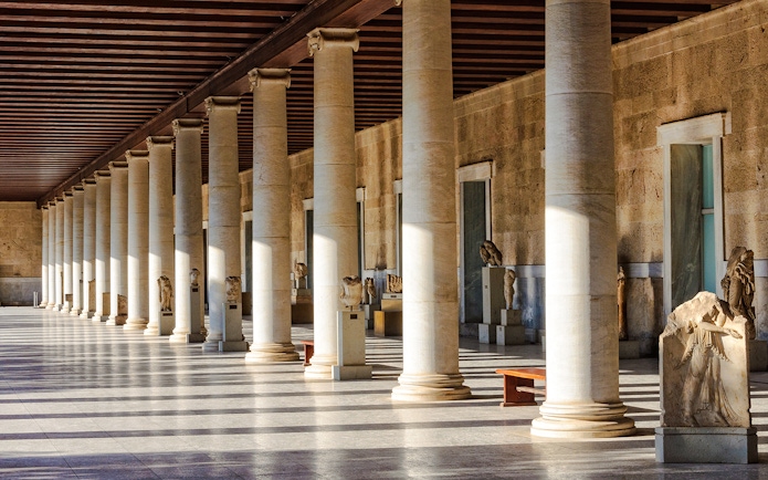 Columns and statues inside the Stoa of Attalos, Athens, Greece.