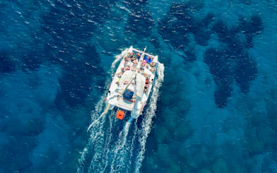 Catamaran sailing on clear blue waters, Rhodes.