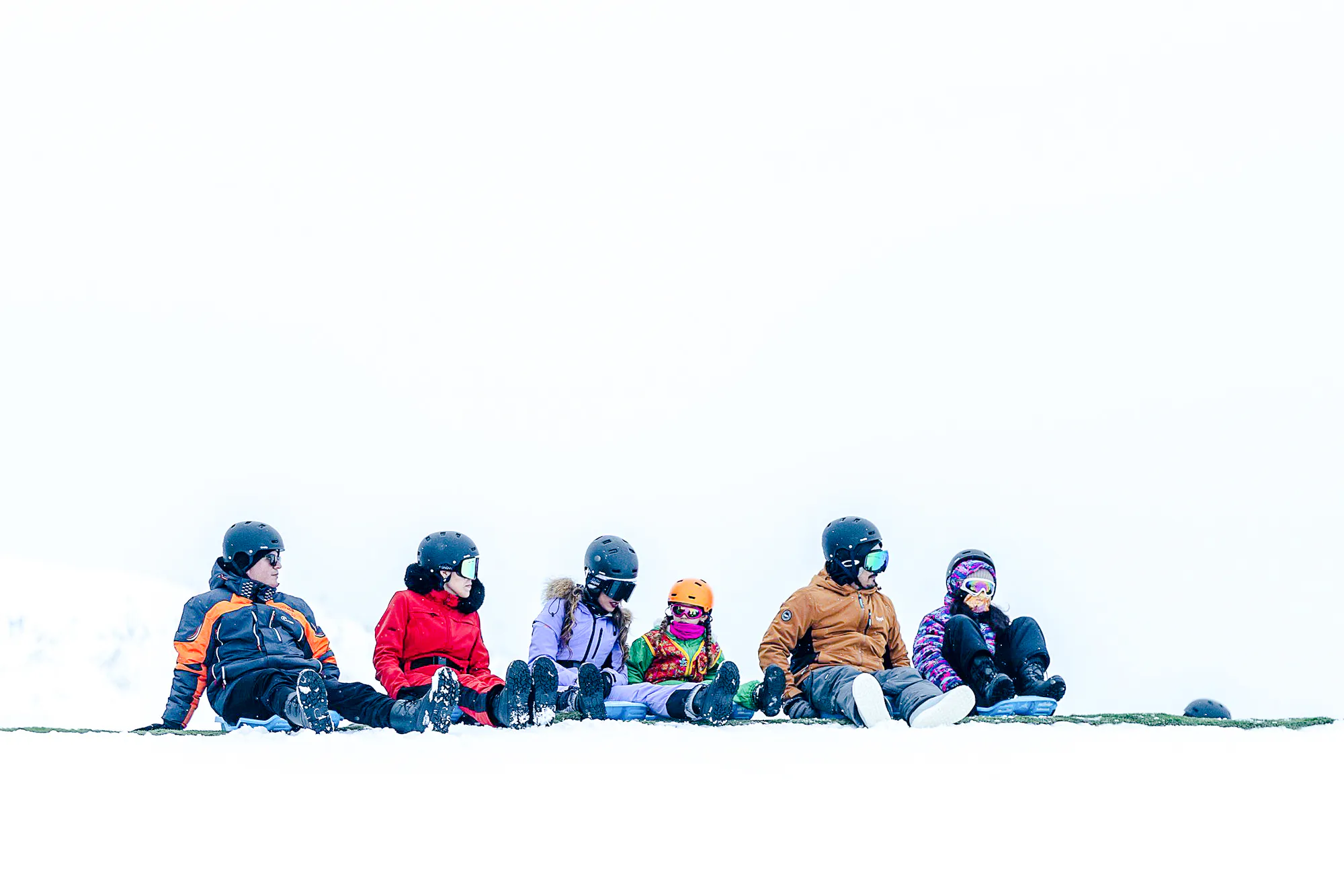 Group of people sitting in snow gear at Valle Nevado, Santiago.